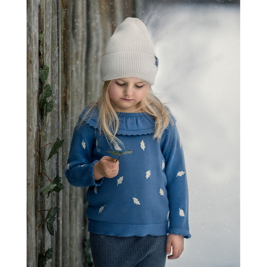 GIRL WEARING KIDS KNIT SWEATER